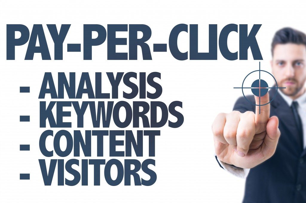 Business man pointing the text: Pay-Per-Click