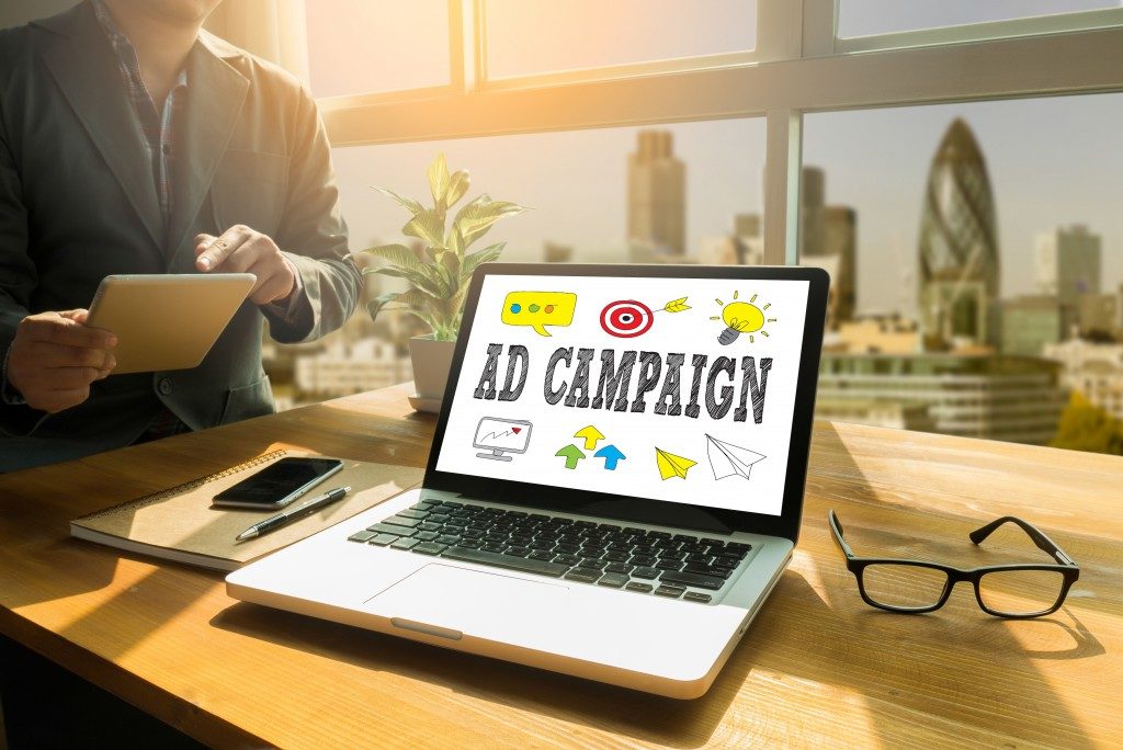 laptop showing an illustration of ad campaign