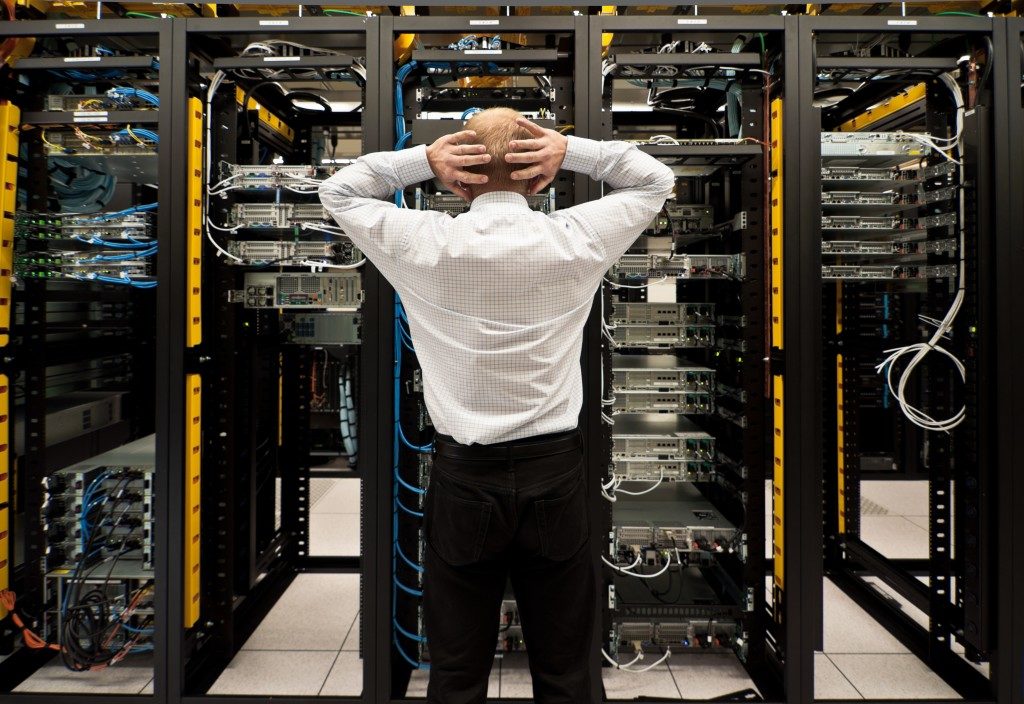 Man looking at the network data center