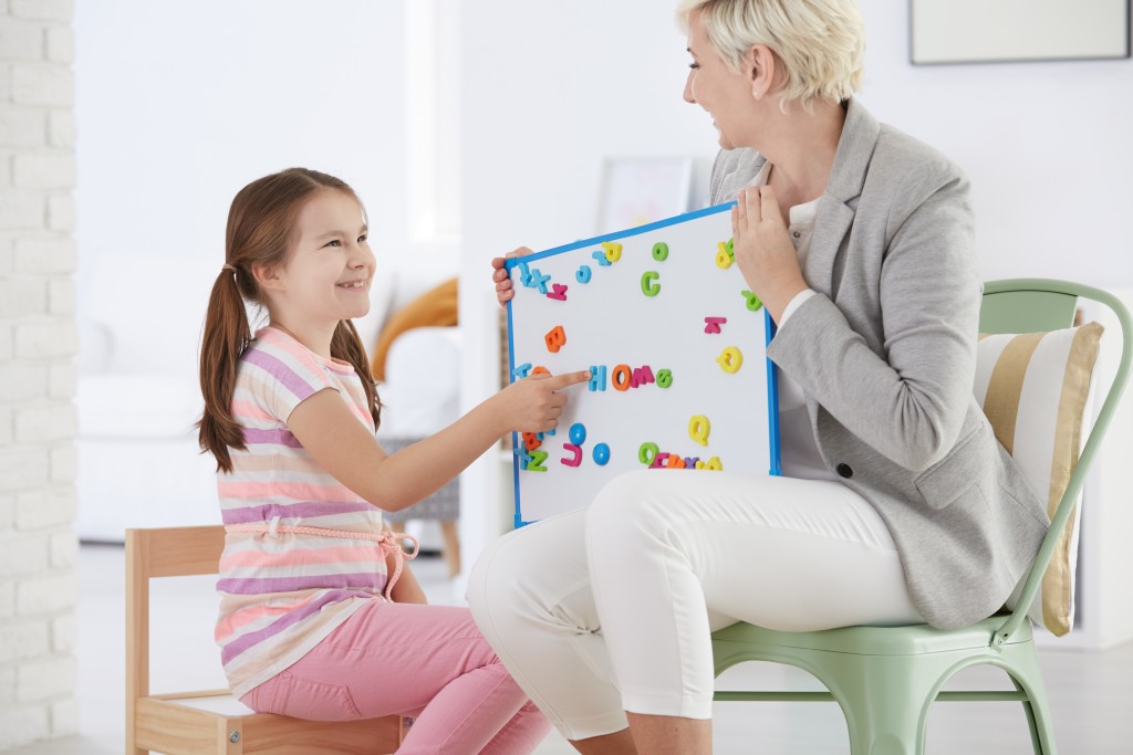 therapist teaching a kid