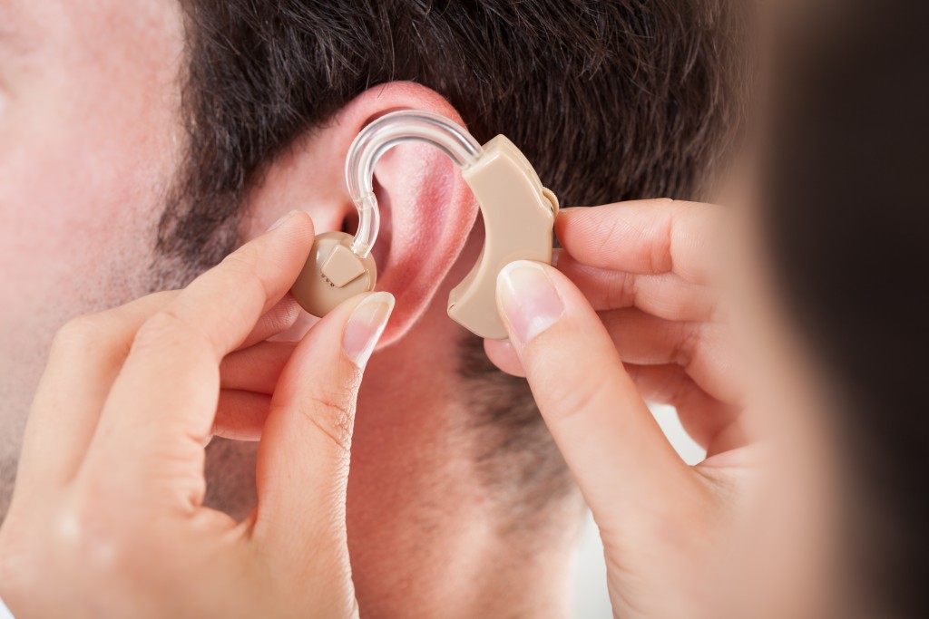 inserting a hearing aid
