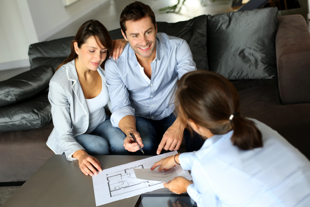 couple talking to a realtor