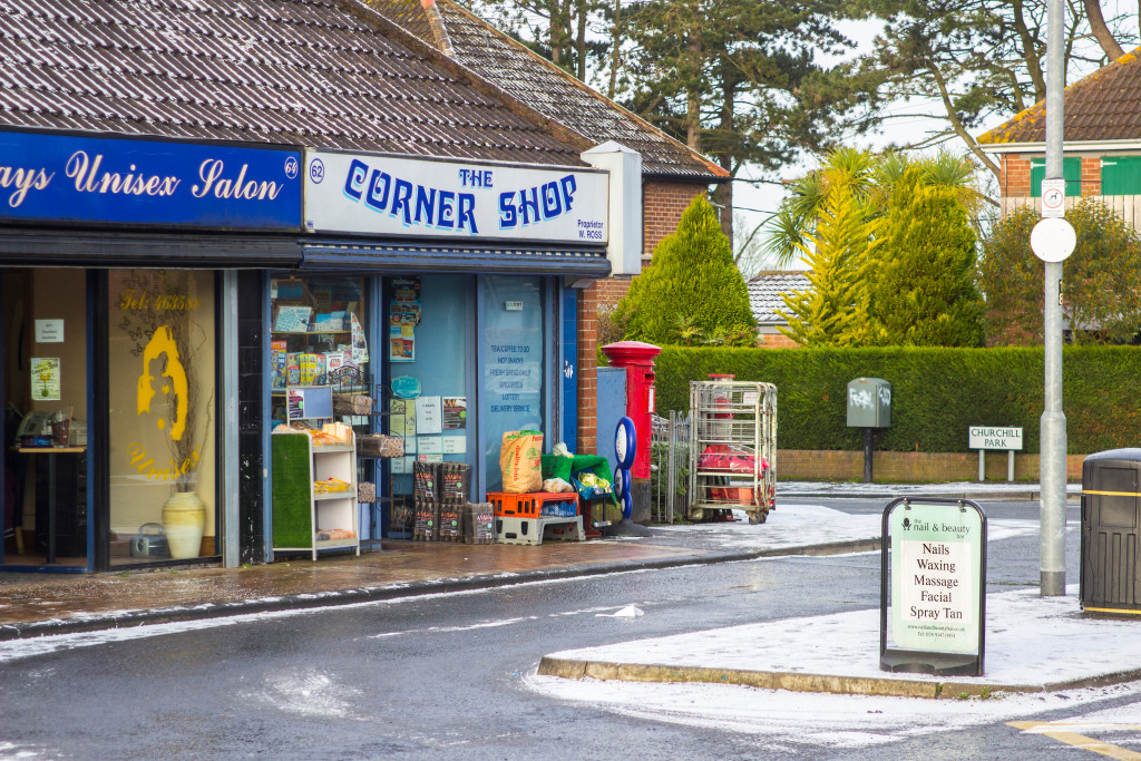 a corner shop with inviting storefront and signage