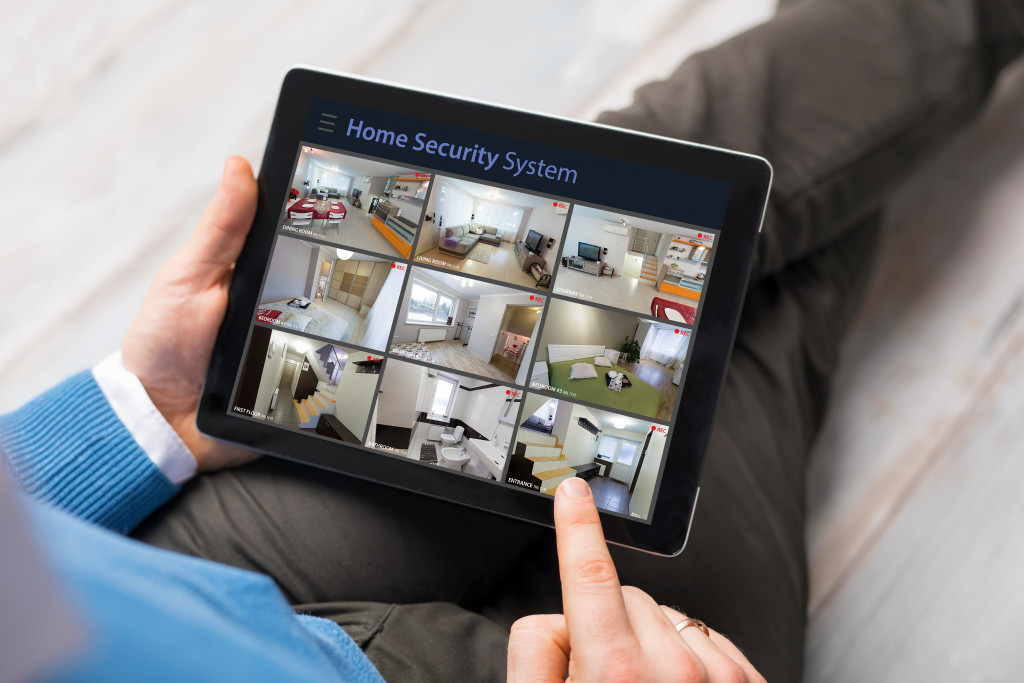 homeowner using a tablet to view cctv