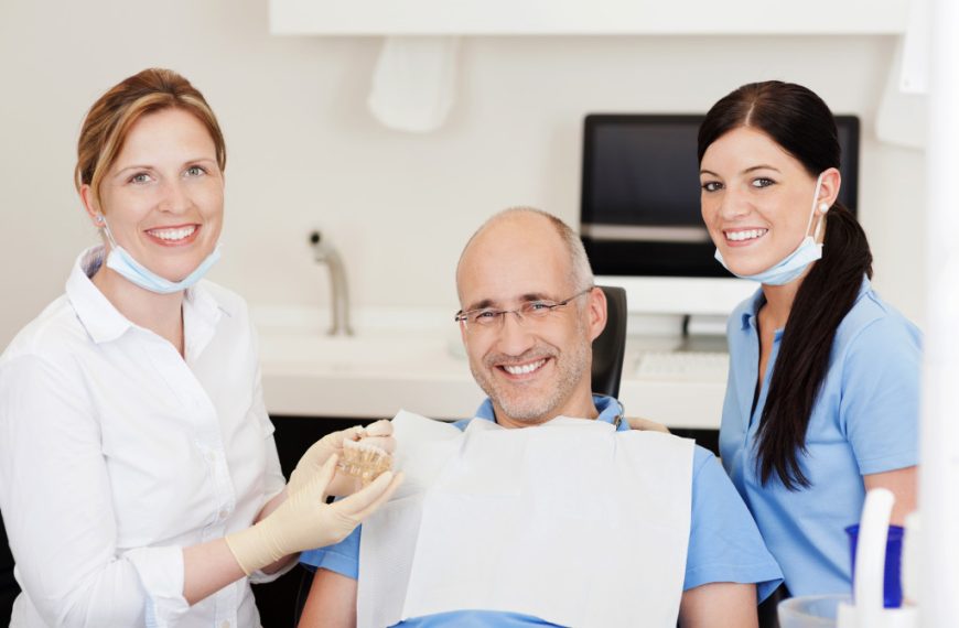 dentist with her assistant and their patient
